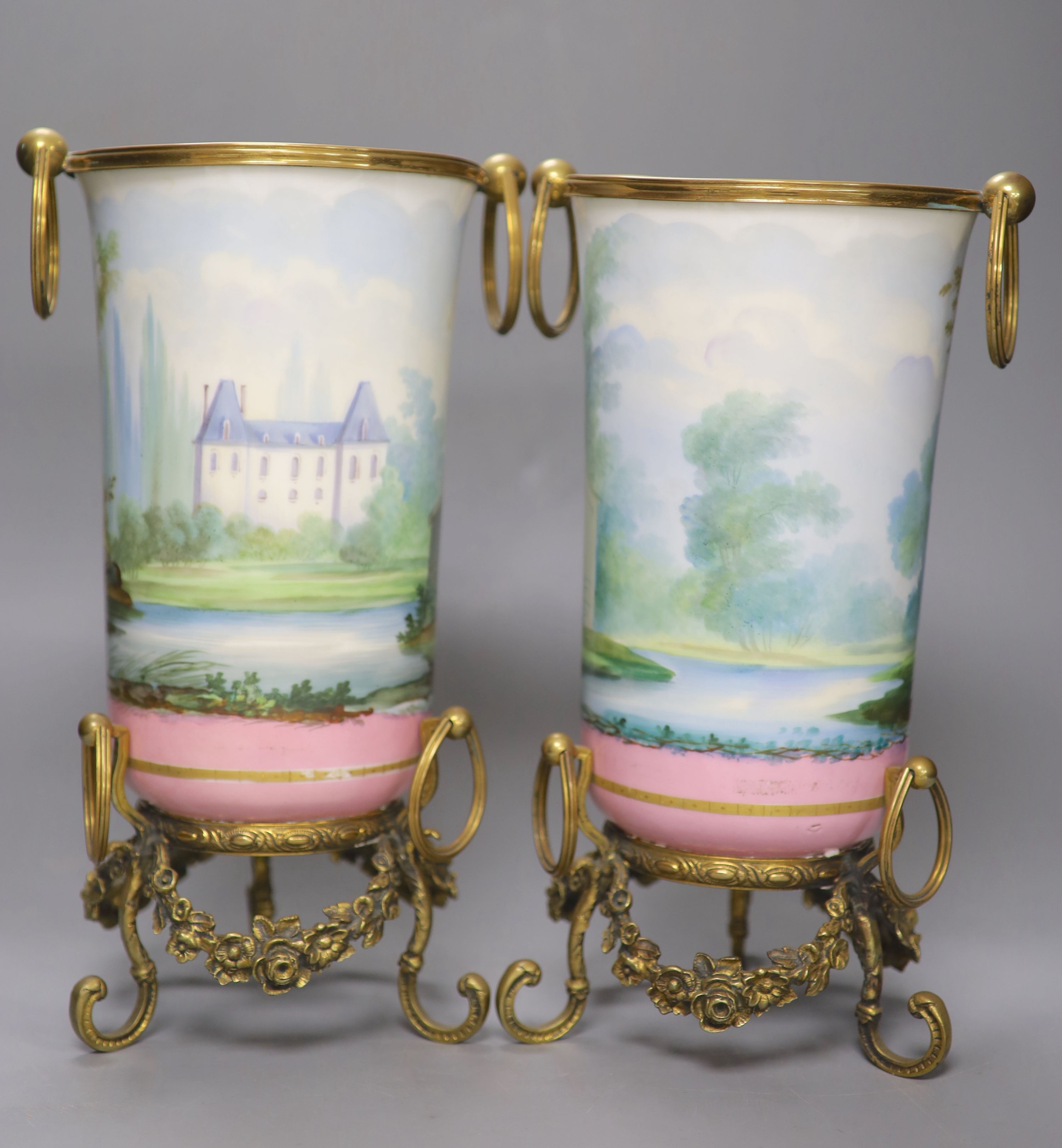 A pair of late 19th century Paris porcelain and gilt metal mounted vases, height 33cm